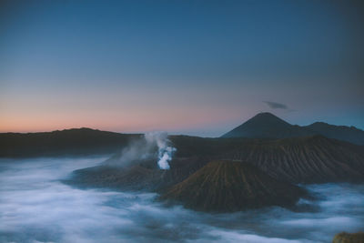 View of volcanic mountain against sky during sunset