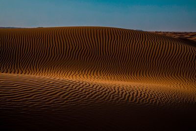 Scenic view of desert against clear sky