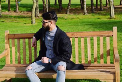Man sitting on railing