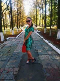 Full length of girl standing in park