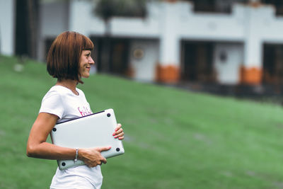 Rear view of woman using mobile phone