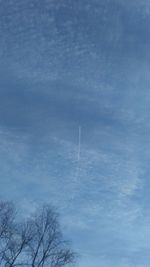 Low angle view of vapor trail in sky