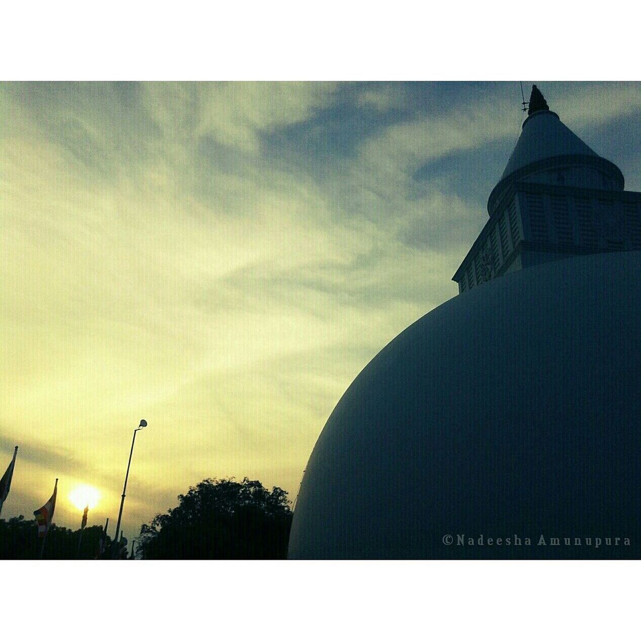 transfer print, architecture, built structure, building exterior, sky, auto post production filter, low angle view, tower, religion, church, cloud - sky, place of worship, spirituality, silhouette, cloudy, tall - high, dusk, outdoors