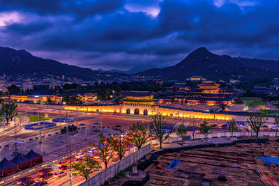 High angle view of illuminated buildings in city at night