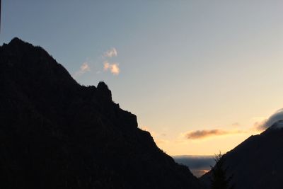 Low angle view of silhouette mountain against sky during sunset