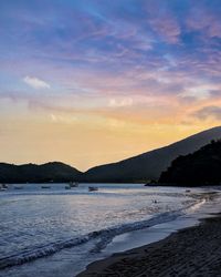 Scenic view of sea against sky at sunset