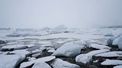 Scenic view of snowcapped landscape against sky