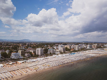 High angle view of buildings against cloudy sky