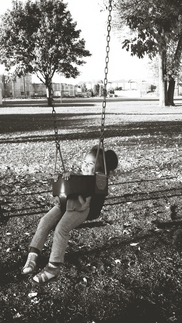 childhood, lifestyles, leisure activity, elementary age, girls, tree, boys, holding, innocence, playing, full length, person, casual clothing, park - man made space, cute, playful, outdoors, playground