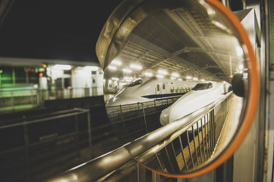 Close-up of train at illuminated railroad station