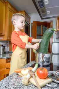 Boy holding food at home
