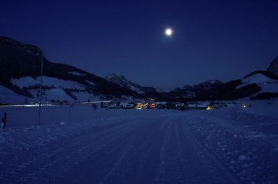 Snow covered mountain at night