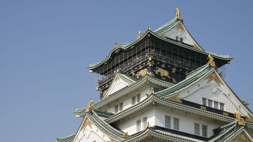 Low angle view of osaka castle against clear sky