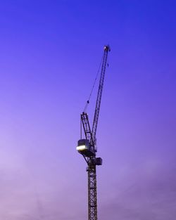 Low angle view of crane at construction site