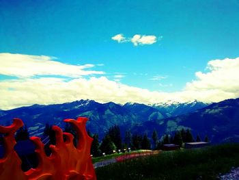 Scenic view of mountains against cloudy sky