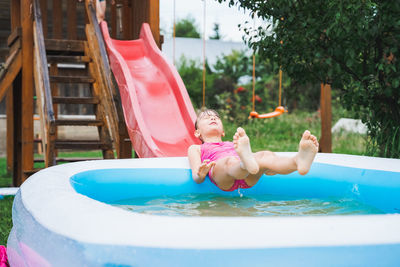 Girl playing in swimming pool