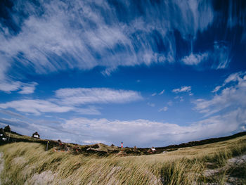 Countryside landscape against blue sky and clouds