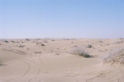 Scenic view of desert against clear sky