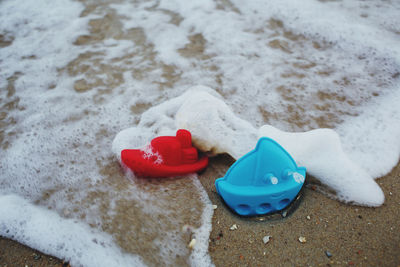 Close-up of toy on sand at beach during winter
