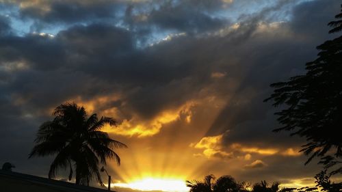 Low angle view of cloudy sky at sunset