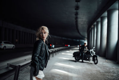 Full length of woman on bridge in city