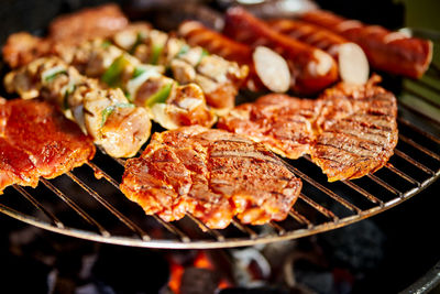 Close-up of meat on barbecue grill