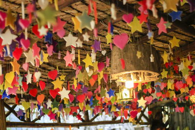 Full frame shot of multi colored umbrellas hanging at market stall