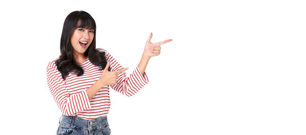 Woman standing against white background