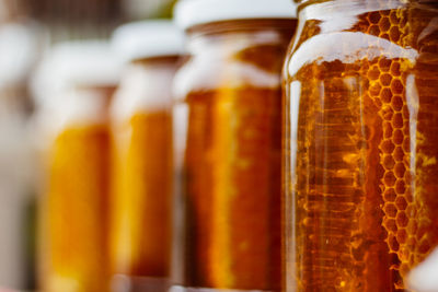 Close-up of honey in glass jars