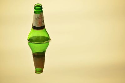 Close-up of beer bottle against white background