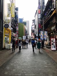 People walking on street in city