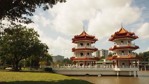 Low angle view of building against cloudy sky