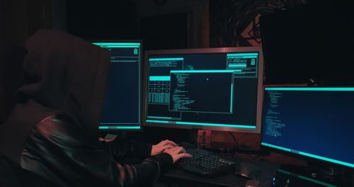 Digital composite image of man using laptop