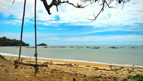 Scenic view of sea against cloudy sky
