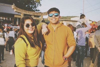 Portrait of friends standing outdoors