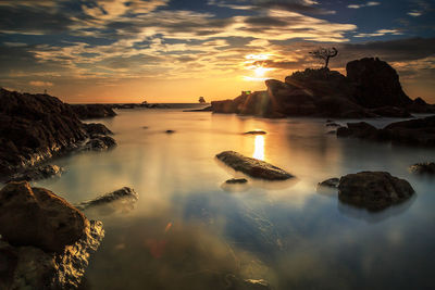 Scenic view of sea against sky during sunset