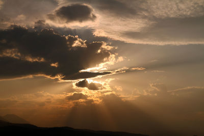 Low angle view of dramatic sky during sunset