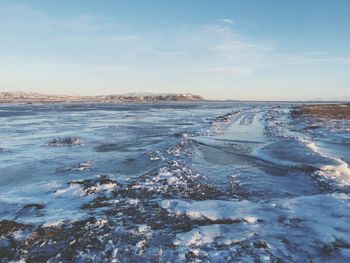 Scenic view of sea against sky during winter