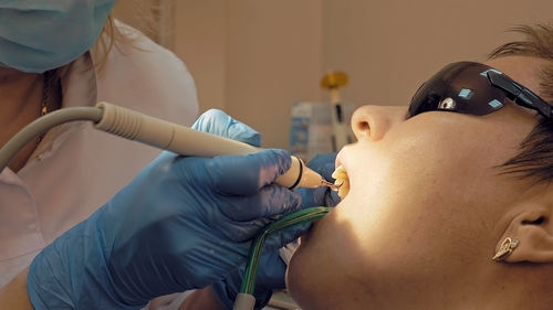 Dentist examining patient