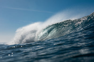 Wave breaking on a summer day at the beach