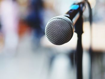 Close-up of microphone against blurred background