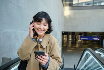 Young woman using mobile phone