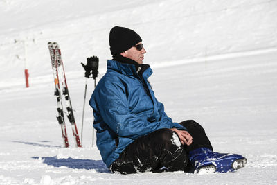 Man sitting on snow