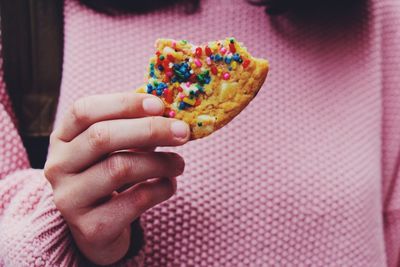 Close-up of hand holding cookie