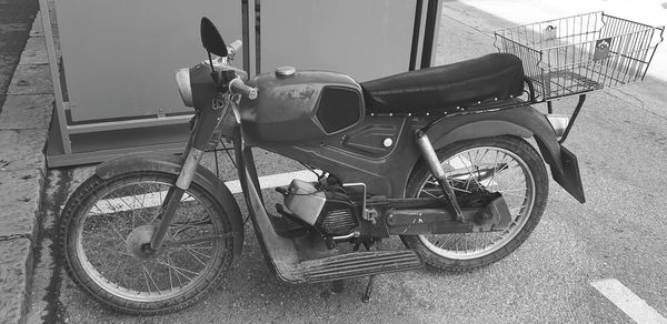 Side view of bicycle on sidewalk