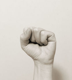 Close-up of hand against white background