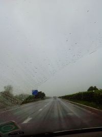 Road seen through car windshield