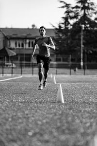 Full length of man running on road