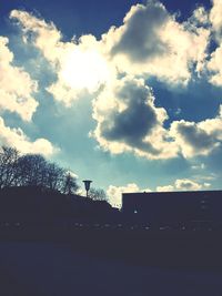 Low angle view of built structure against cloudy sky