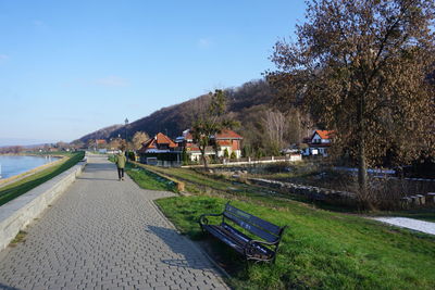 Scenic view of river by mountains against sky